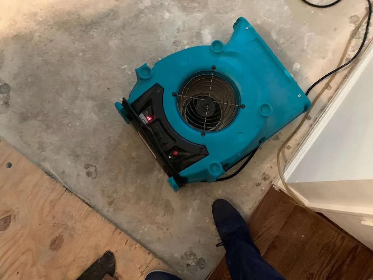 Air mover drying subfloor during Leak Detection & Repair in Pantops